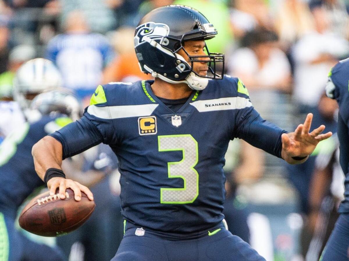 Russell Wilson prepares to throw in the fourth quarter of last week’s win over Dallas. The Seahawks’ franchise quarterback offered a rare introspective on Thursday by describing a regret he has from early in his NFL career.