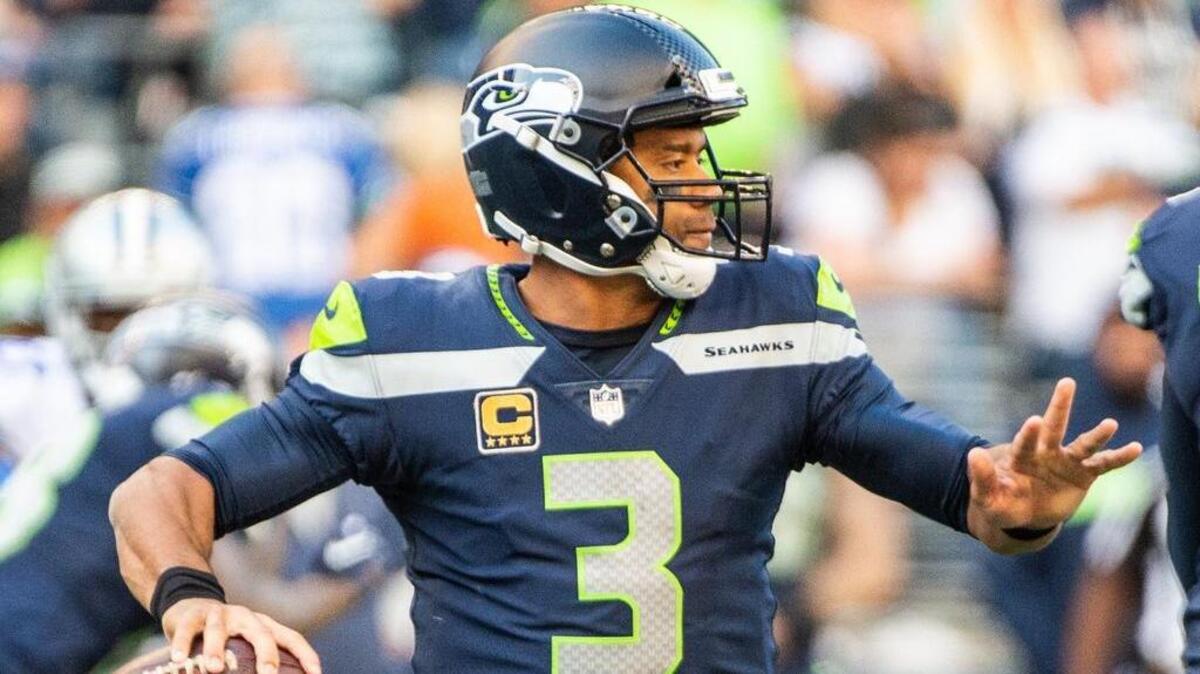 Russell Wilson prepares to throw in the fourth quarter of last week’s win over Dallas. The Seahawks’ franchise quarterback offered a rare introspective on Thursday by describing a regret he has from early in his NFL career.