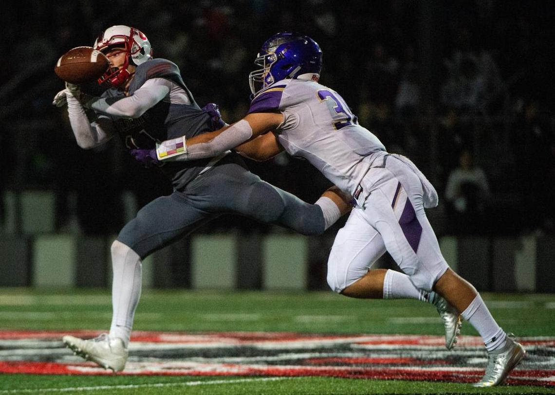 Puyallup’s Danny Uluilakepa (30) breaks up a pass intended for Mount Si’s Kevin Corder in the third quarter. Puyallup played Mount Si in a football game at Mount Si High School in Snoqualmie, Wash., on Friday, Nov. 16, 2018.