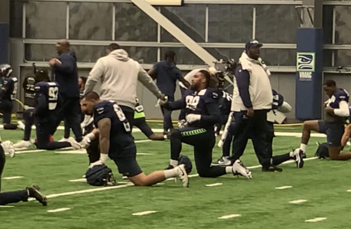 New defensive lineman Leonard Williams (99) saying hello to Seahawks coaches at the start of his first practice with the team, Nov. 1, 2023. Seattle acquired him from the New York Giants in a trade Oct. 30, 2023.