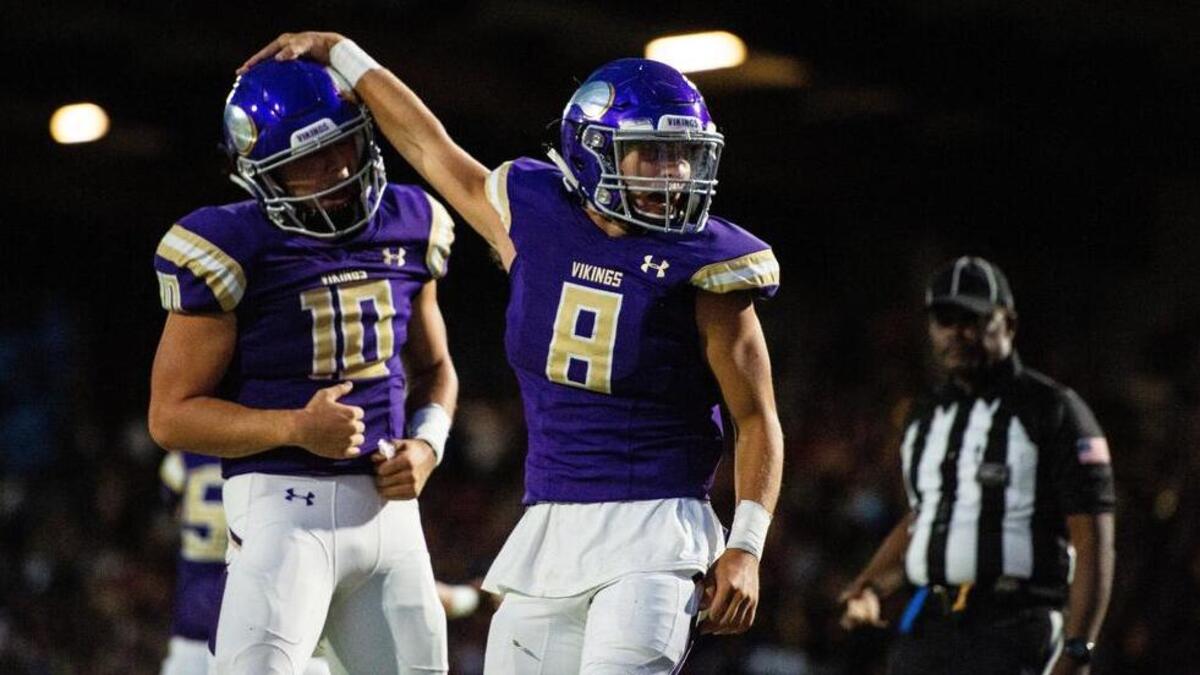Puyallup’s Kyle Cramer (8) and Puyallup’s Jacob Holcomb (10) celebrate a rushing touchdown in the first quarter. Puyallup high school played Sumner high school in a football game at Sparks Stadium in Puyallup, Wash., on Friday, Sept. 14, 2018.