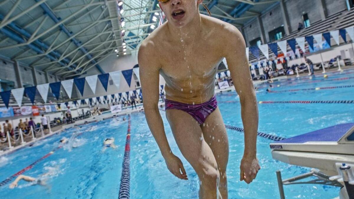 Seth Koivisto of Steilacoom High School emerges Thursday after some laps during swim practice with his team at the King County Aquatic Center in Federal Way.