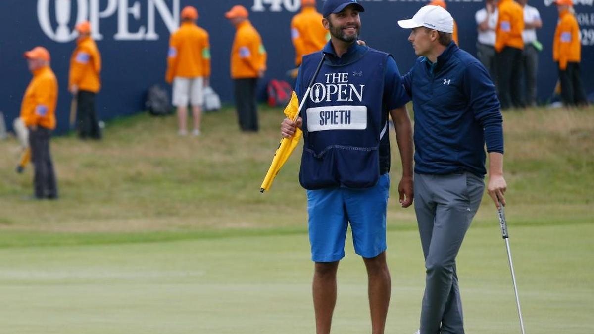 Jordan Spieth stands with his caddie Michael Greller before putting on the 18th green Sunday at the British Open Golf Championship, at Royal Birkdale, Southport, England. Greller once taught at University Place Primary and lives in Gig Harbor.