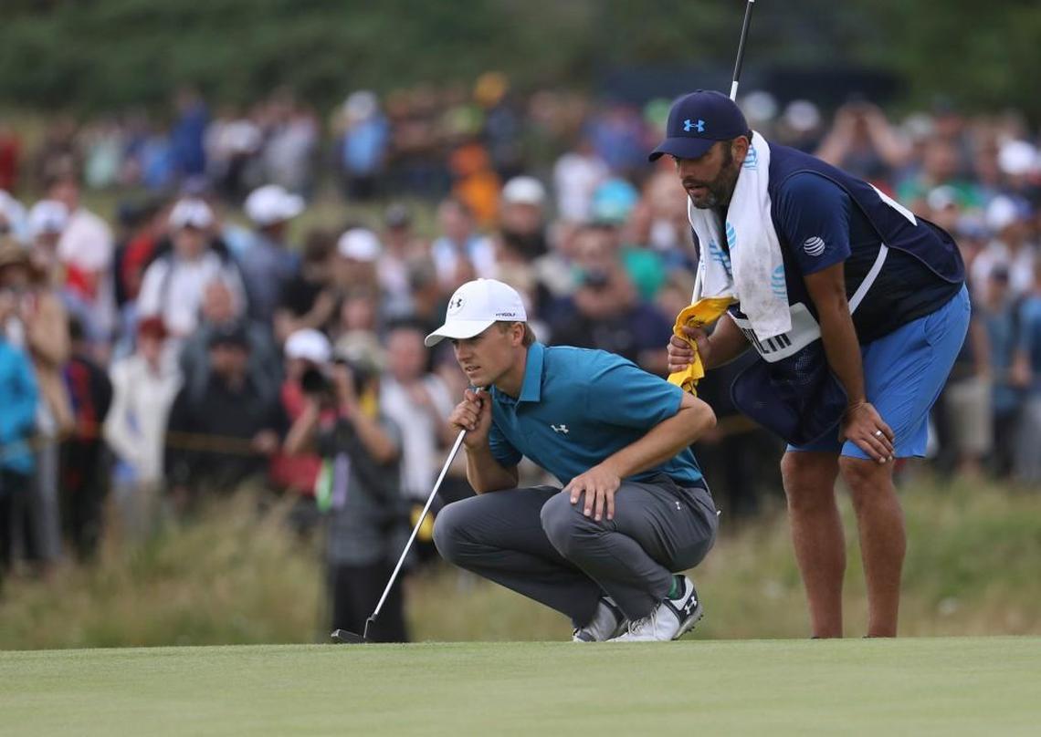 Jordan Spieth and his caddie Michael Greller line up a putt on the 9th green Sunday during the final round of the British Open Golf Championship, at Royal Birkdale, Southport, England.