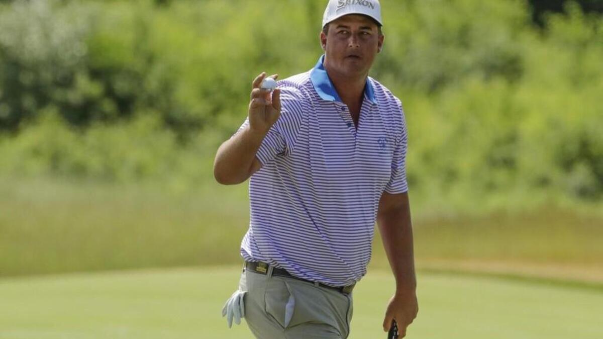 Michael Putnam reacts after making a putt on the third hole during the first round of the U.S. Open golf tournament Thursday at Erin Hills in Erin, Wis.