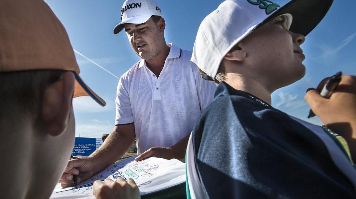 
Michael Putnam signs autographs by the driving range early in the morning. First day of practice rounds at the 115th U.S. Open at Chambers Bay Monday June 15, 2015.
