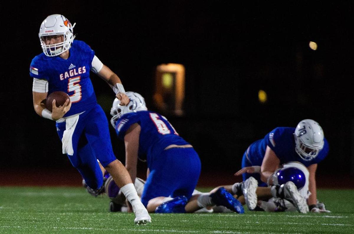Graham-Kapowsin’s Dylan Morris (5) scrambles in the third quarter. Graham-Kapowsin played Puyallup in a football game at Art Crate Field in Spanaway, Wash., on Friday, Sept. 21, 2018.