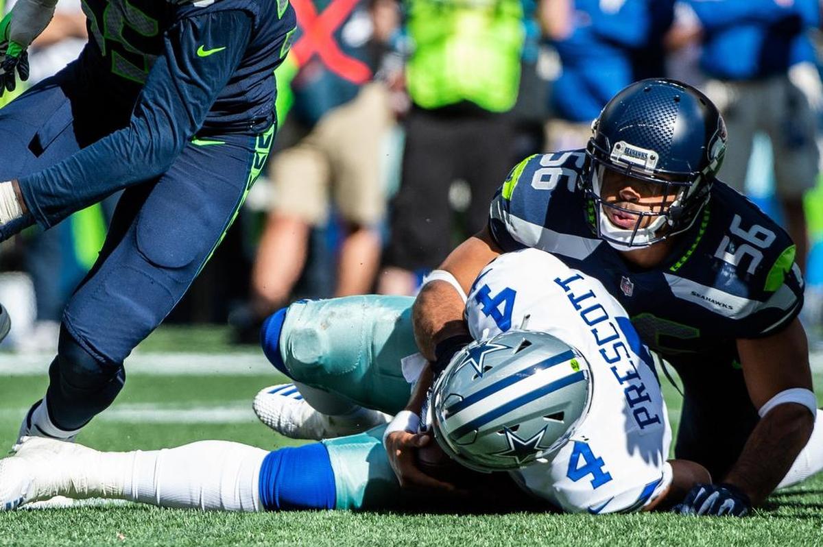 Seahawks linebacker Mychal Kendricks sacks Cowboys quarterback Dak Prescott. The Seattle Seahawks played the Dallas Cowboys in a NFL football game at CenturyLink Field in Seattle, Wash., on Sunday, Sept. 23, 2018.