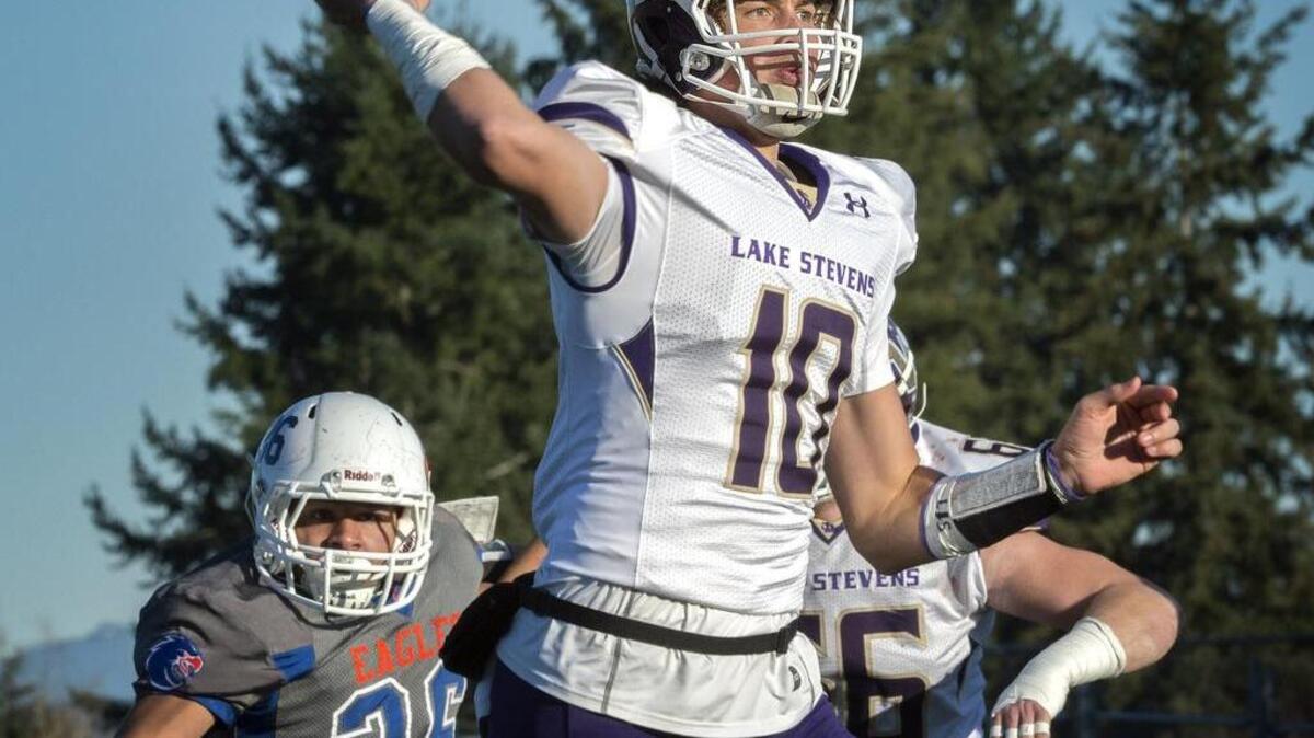 Lake Stevens quarterback Jacob Eason stands tall to complete a touchdown pass against Graham-Kapowsin at Art Crate Field on Saturday. The Vikings is one of the top college football recruits in the nation, but he’ll play his first game in the Tacoma Dome on Saturday night against Skyline.
