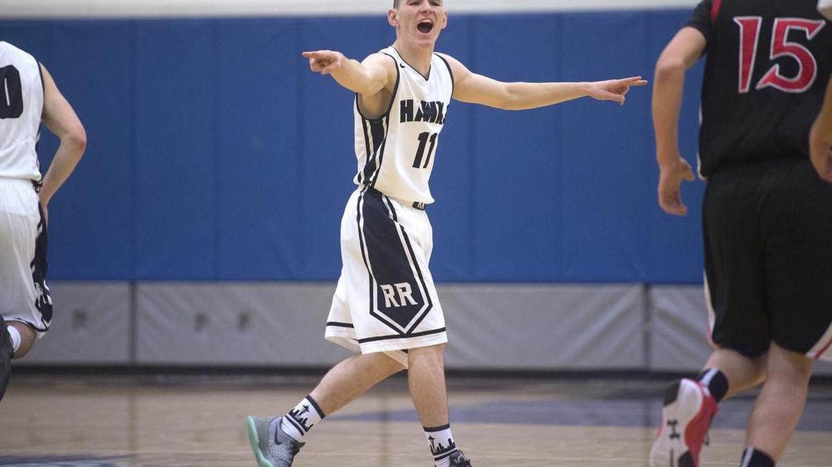Point guard Kobe Key directs the River Ridge Hawks on the court. “He understands how to win,” coach John Barbee says of the senior.