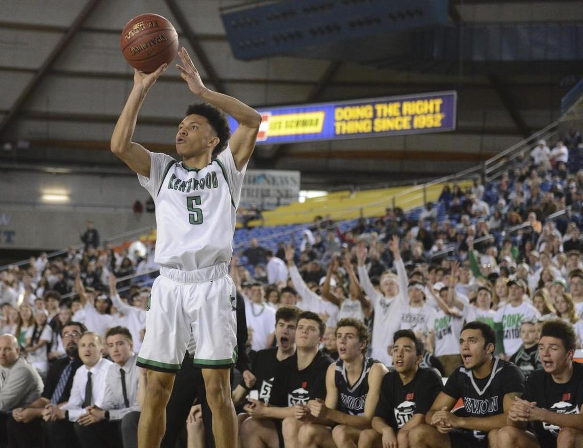 Kentwood's D'angelo Minnis (5) hits a three-point-shot to tie the game at 35-35 in the second quarter. Kentwood played Union in the 4A boys state championship basketball game at the Tacoma Dome in Tacoma, Wash., on Saturday, March 4, 2017.