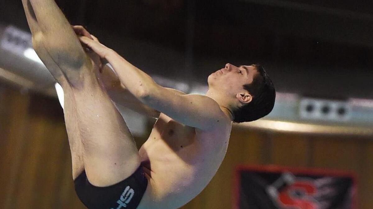 Shelton’s Zach Netzel practices Wednesday at the Highclimbers’ pool for this week’s state diving championships. He is the No. 8 seed.