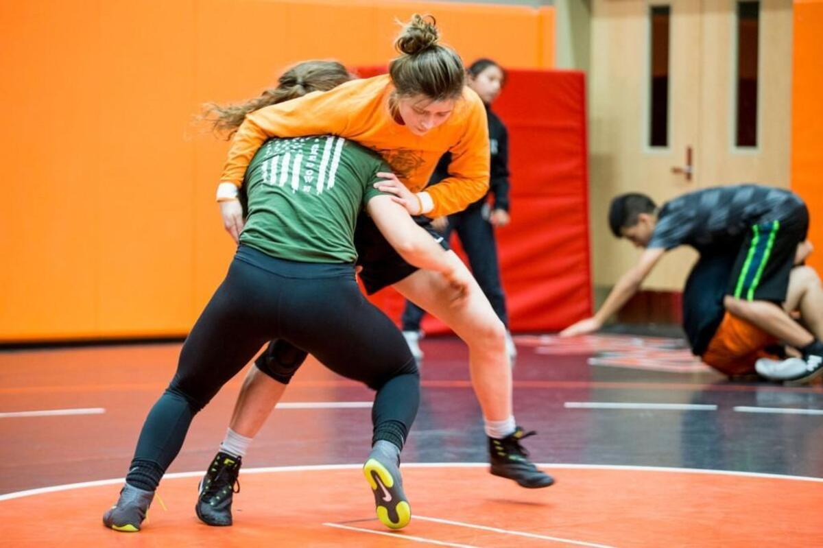 Cameron Guerin grapples with Emma Bruntil, also a member of the national team, during practice at Davis High School in Yakima, Wash. on Thursday, Dec. 21, 2017.