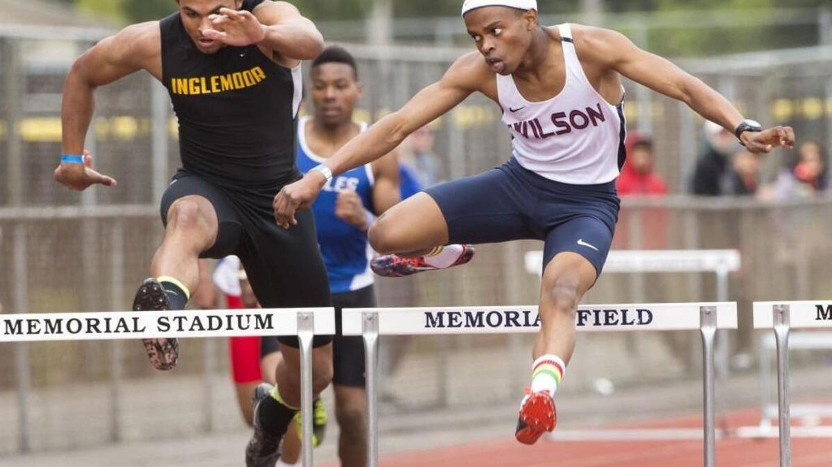 Wilson’s David Njeri, right, keeps an eye on Inglemoor’s Jalen Woodley who he edged out for a victory in the 300-meter hurdles. Njeri also took first in the 110-meter hurdles. Photo taken in Federal Way on Saturday, April 29, 2017.