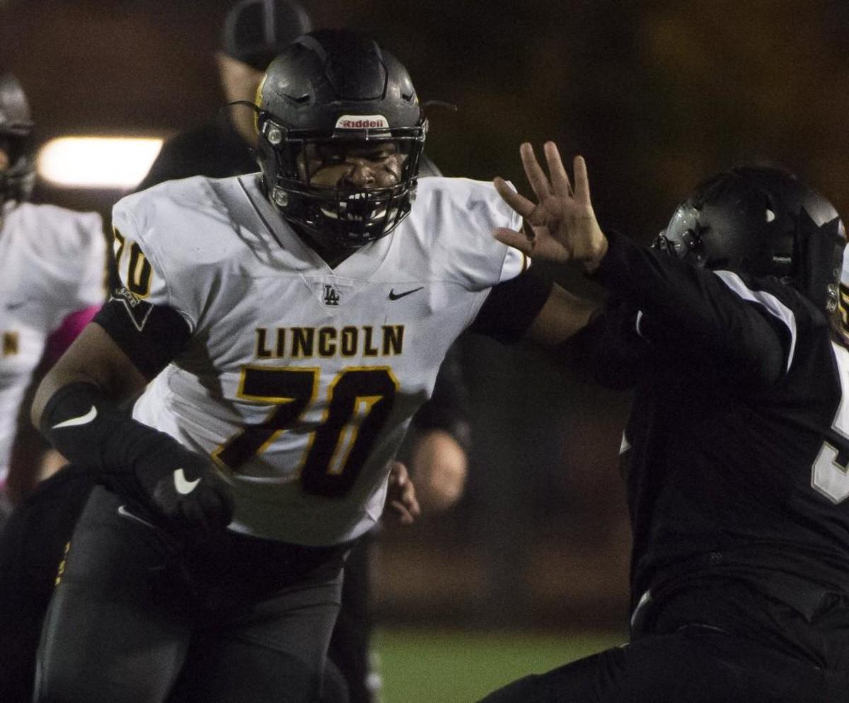 Lincoln's Giovonni White (70) works against Bonney Lake's Bull Richardson in the first quarter. Bonney Lake played Lincoln in a football game at Sunset Stadium in Sumner, Wash., on Friday, Oct. 20, 2017.