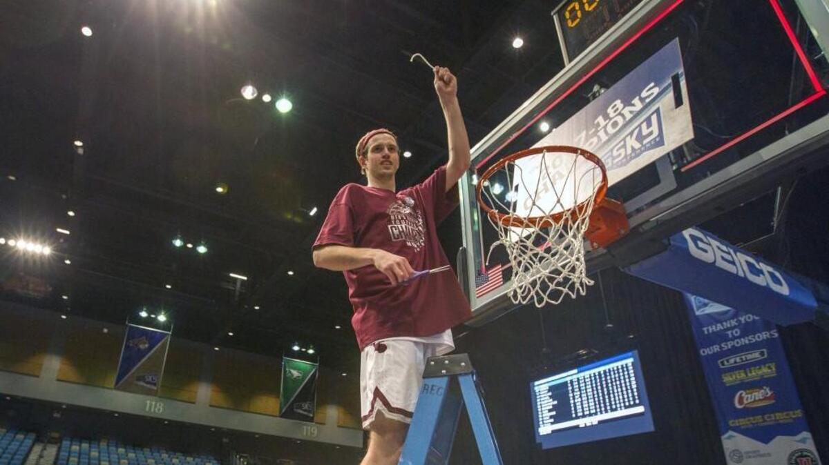 Montana's Bobby Moorehead cuts down the netsafter a win over Eastern Washington in the Big Sky championship NCAA college basketball game in Reno, Nev., Saturday, March 10, 2018.