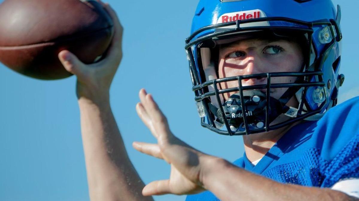 Coeur d’Alene High School Vikings quarterback Colson Yankoff throws the ball during summer training camp.