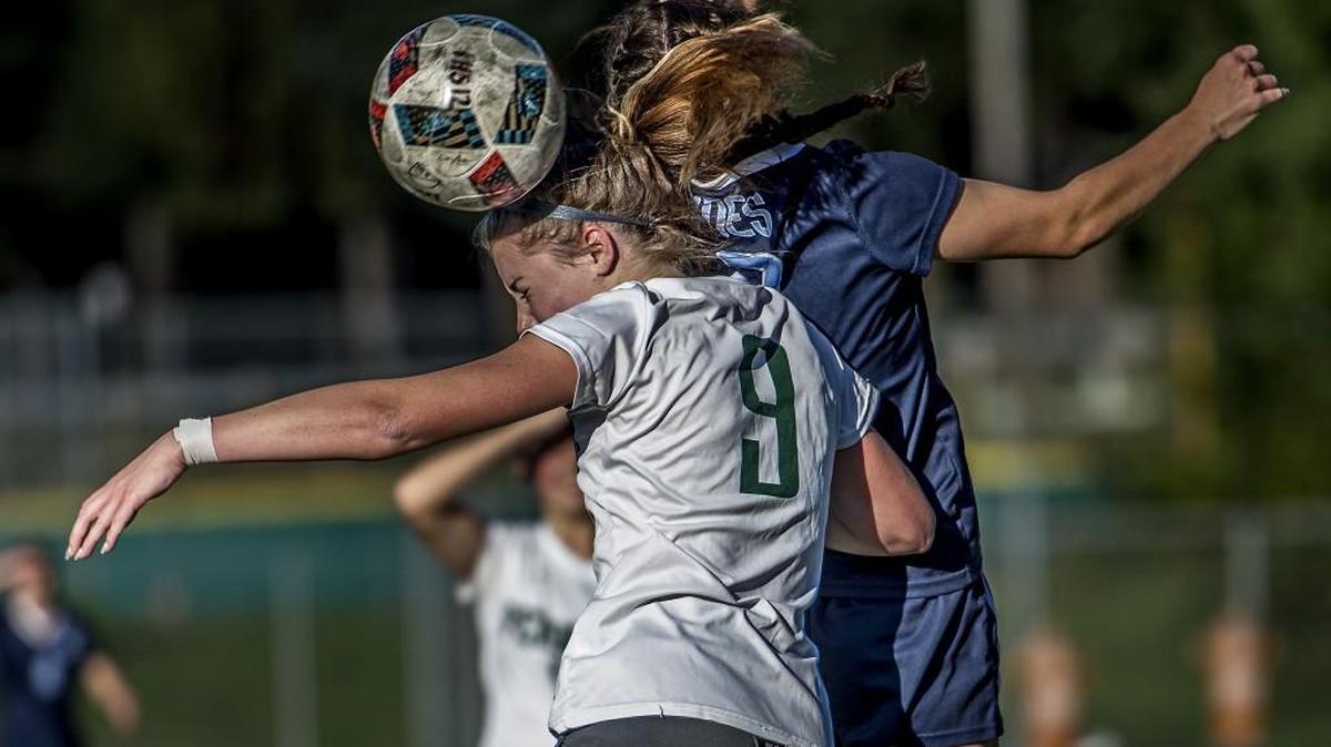 Peninsula midfielder Kaycee Lovell (9) battles Gig Harbor's Alyssa Gray (14) for the ball during the Gig Harbor vs Peninsula soccer match at Roy Anderson Field in Purdy, Wash., Friday, Oct. 13, 2017, in a battle of first versus second place in the Class 3A South Sound Conference. The Tides win 4-1.