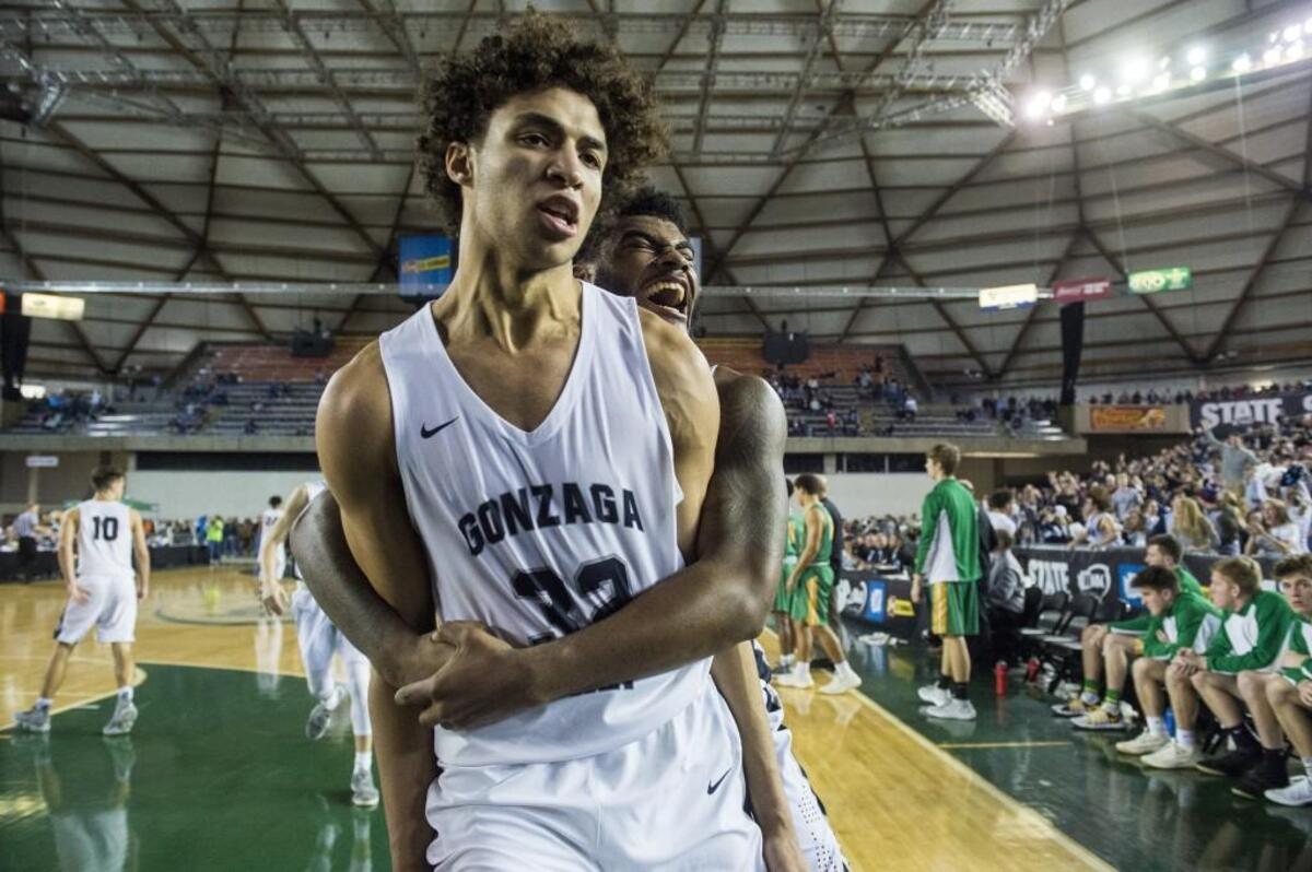 Gonzaga Prep’s Anton Watson (32) and Devin Culp (20) celebrate Watson’s game-winning three point shot. Richland played Gonzaga Prep in a semifinal bracket game at the Hardwood Classic state basketball tournament at the Tacoma Dome in Tacoma, Wash., on Friday, March 2, 2018.
