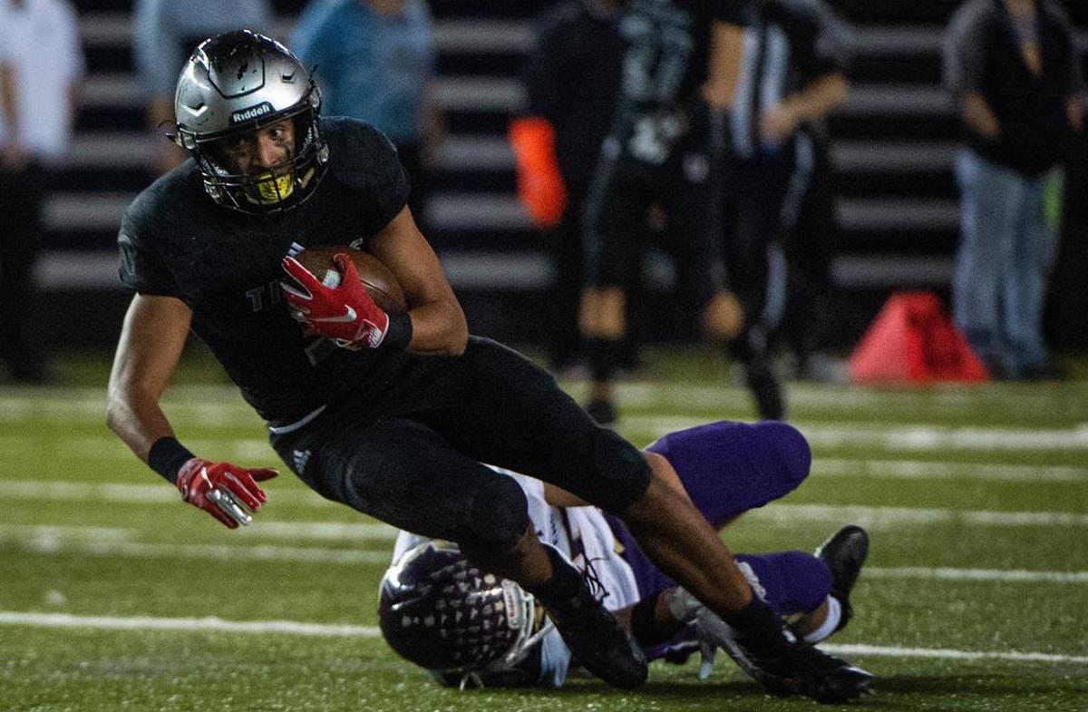 Union’s Darien Chase (3) is tackled after a catch in the second quarter. Union played Lake Stevens in the WIAA 4A football state championship game at the Tacoma Dome in Tacoma, Wash., on Saturday, Dec. 1, 2018.