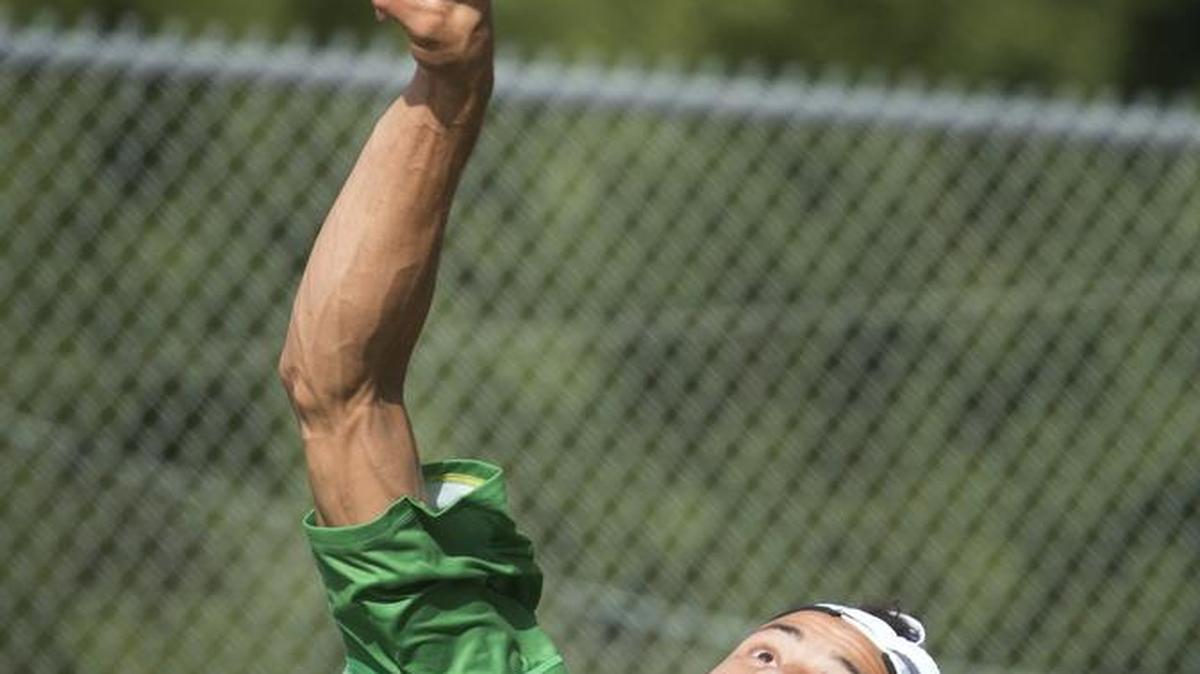 Three-line cutline for this photo. Three-line cutline for this photo. Tumwater senior Ty Gentry fires a serve during a match during the regular season in September 2015.