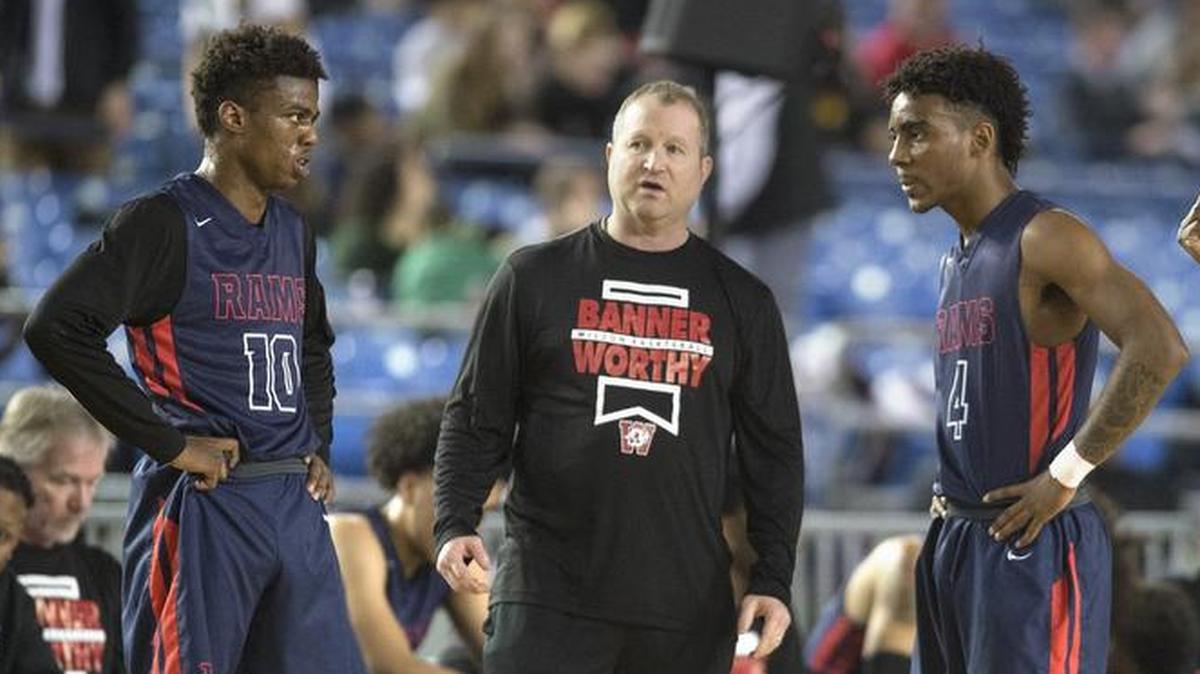 Wilson head coach Dave Alwert talks with Londrell Hamilton (from left), Daniel Santana and Dominique Ellison during Thursday’s 3A boys basketball state quarterfinal game against Rainier Beach in the Tacoma Dome on March 1, 2018.
