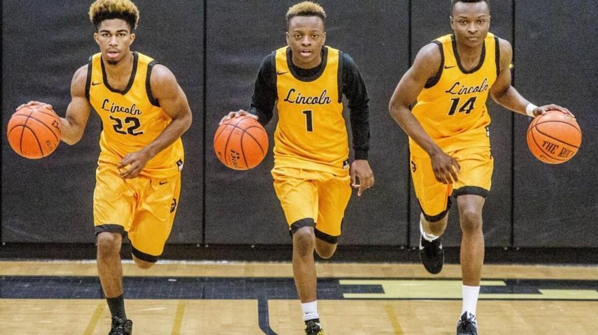 Brothers Brandon, left to right, Tashon and Trevion Brown play on the Lincoln High School boys basketball team.