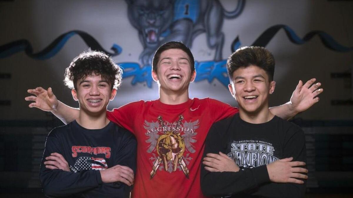 At 120 pounds, Bonney Lake senior wrestler Brandon Kaylor (center) is a heavyweight alongside fellow state champion contenders freshman 106-pounder Yusief Lillie (left) and junior 113-pounder Brenden Chaowanapibool. The trio is shown before wrestling practice at Bonney Lake High School on Tuesday, Feb. 13, 2018.