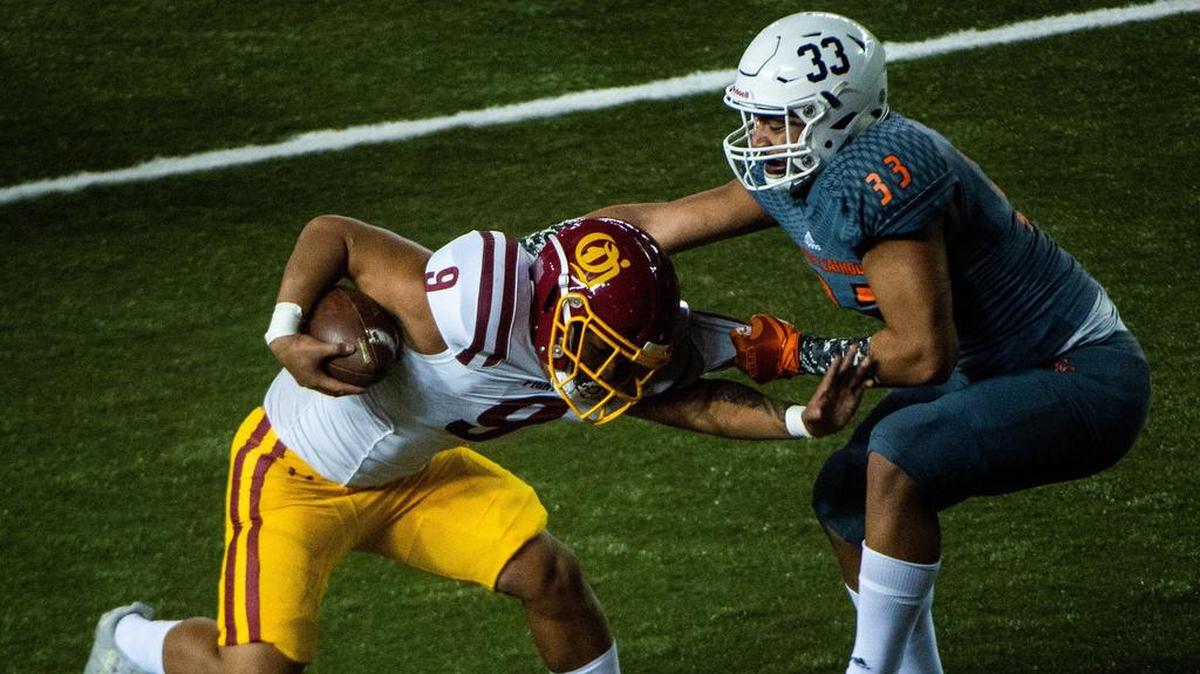 Eastside Cathoic’s Jaylahn Tuimoloau (33) tackles O’Dea’s Mark Tafia in the second quarter. Eastside Catholic played O’Dea in the WIAA 3A football state championship game at the Tacoma Dome in Tacoma, Wash., on Friday, Nov. 30, 2018.