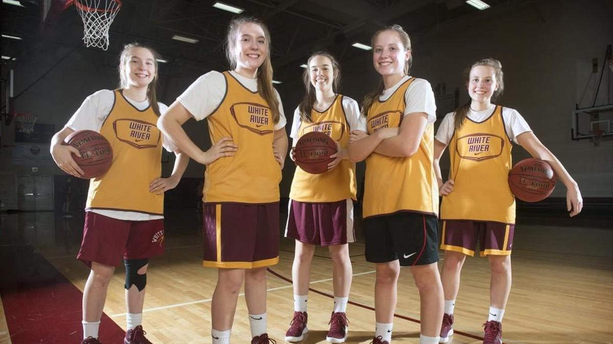 White River girls basketball team has opponents seeing double in senior identical twins Sofia Lavinder and Georgia Lavinder (left) and Megan Cash and Emma Cash (right). Sandwiched in between is another twin, freshman Taylor Schmidtke, who also has a twin sister, Tori Schmidtke. They are shown during a break from basketball practice at White River High School outside Buckley on Wednesday, Jan. 10, 2018.