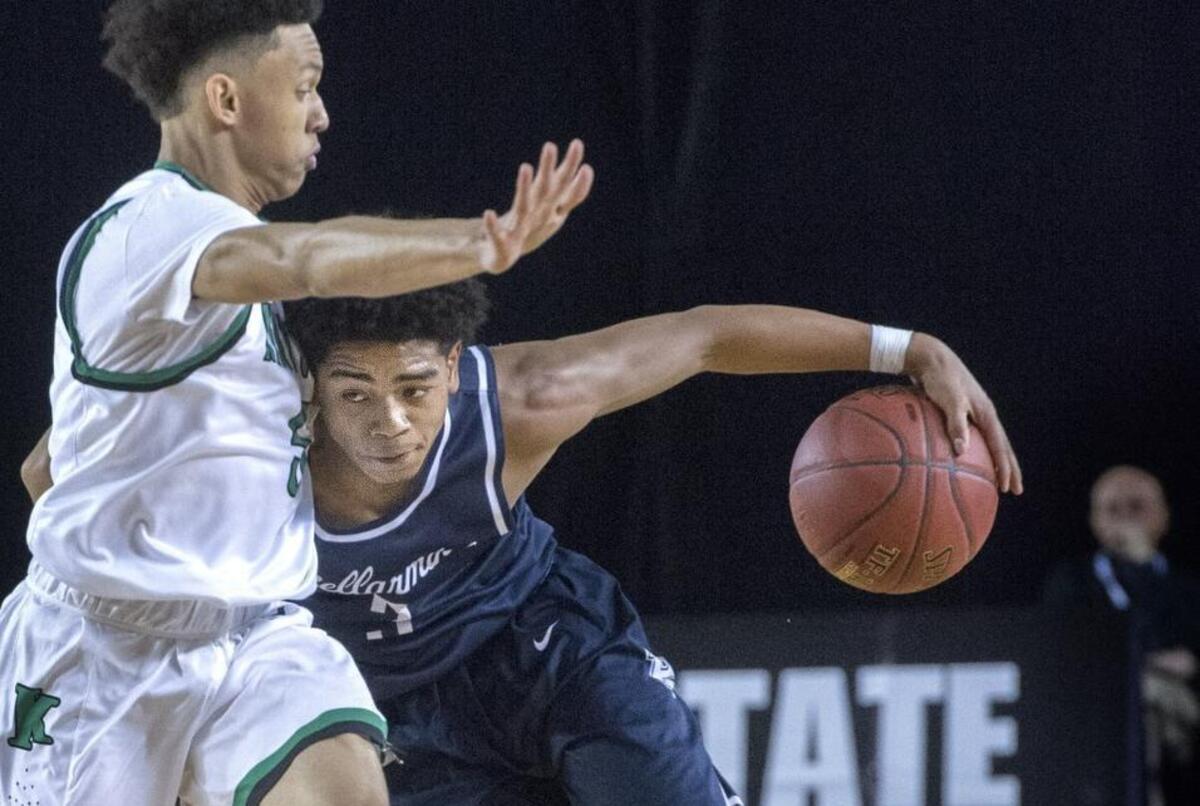 Bellarmine Prep’s Charles Elzie runs into Kentwood’s D’angelo Minnis while bringing the ball up court at Tacoma Dome on Wednesday, Mar. 1, 2017.