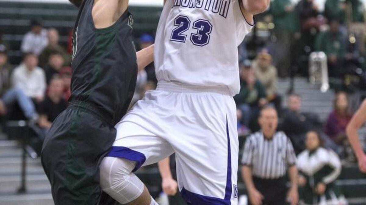 North Thurston’s Clay Christian (23) runs into the defense of Timberline’s Erik Stevenson. Christian, a junior, scored 33 points on Friday night.