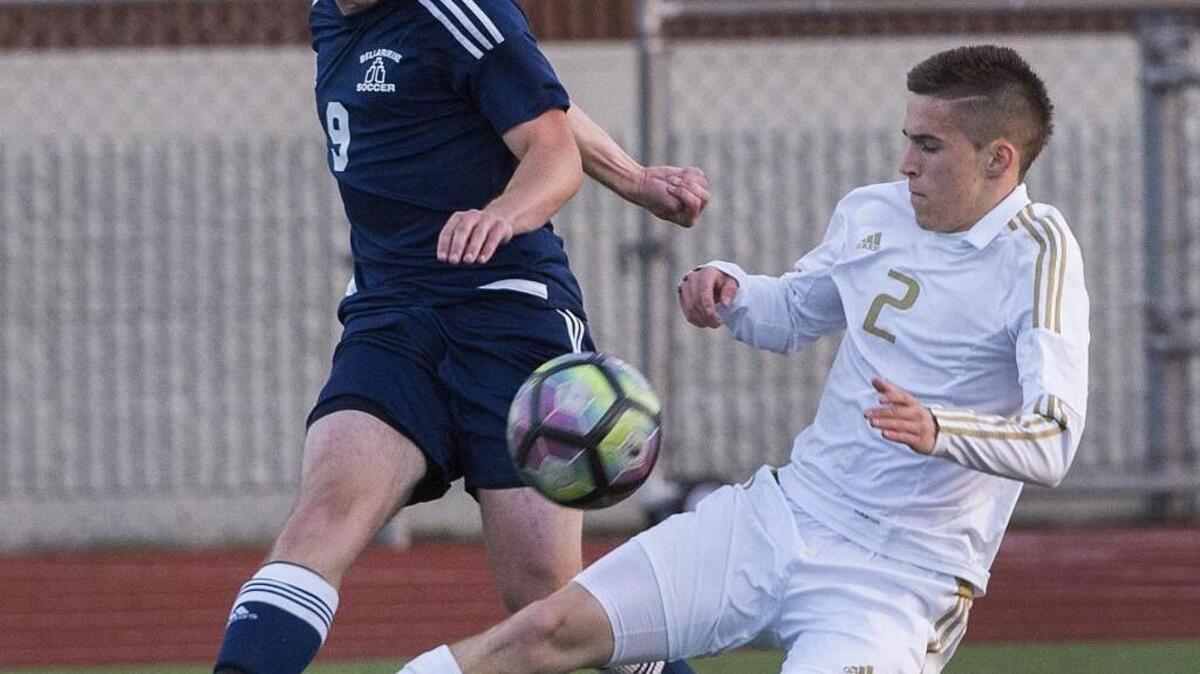 Bellarmine Prep's Kyle Casey, left, and Puyallup's Blake Nelson jockey for position. Casey was selected as the offensive player of the year in the 4A SPSL.