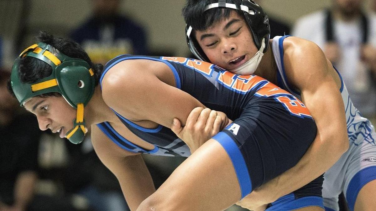 Aizayah Yacapin of Curtis, right, started the Vikings' march to a resounding team title with an eventual pin of Graham-Kapowsin's Noah Cortez in the 106-pound weight class. Photo taken at the 4A regional wrestling championships at Curtis High in University Place on Saturday, Feb. 11, 2017.