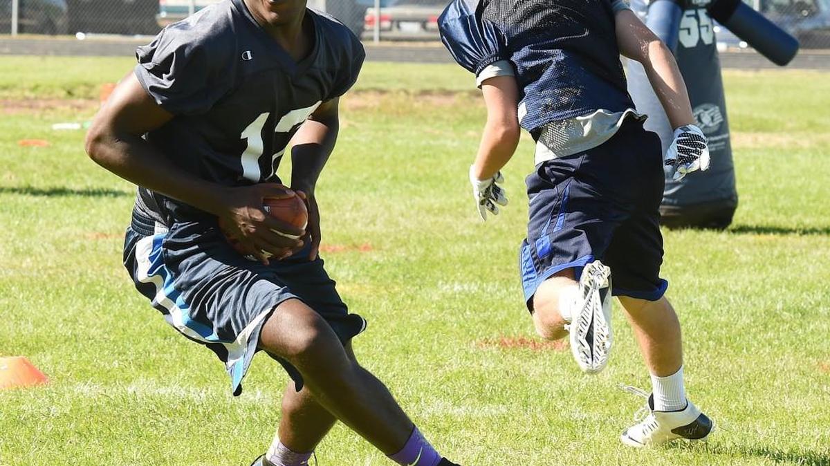 River Ridge’s Kelle Sanders is a Washington State University football recruit at defensive end, but will also play quarterback for the Hawks this season.