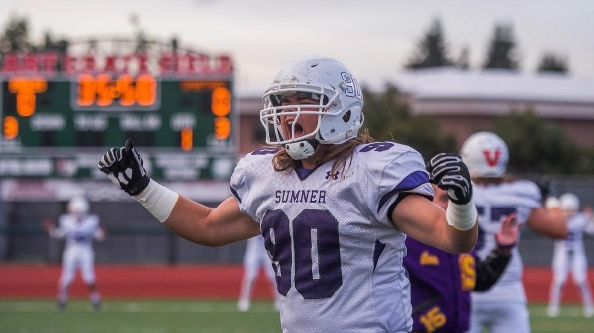 Torben Deese of Sumner High School helps his team get in the mood before a football game at Art Crate Field on Friday.