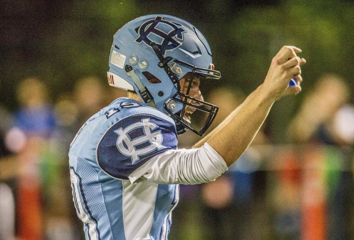 Gig Harbor quarterback Ben Hollenbeck (19) celebrates the Tides' first touchdown. The Gig Harbor Tides face off against crosstown rivals Peninsula Seahawks for the 39th edition of the Fish Bowl at Roy Anderson Field Friday, Sept. 15, 2017. Seahawks win 31-21.
