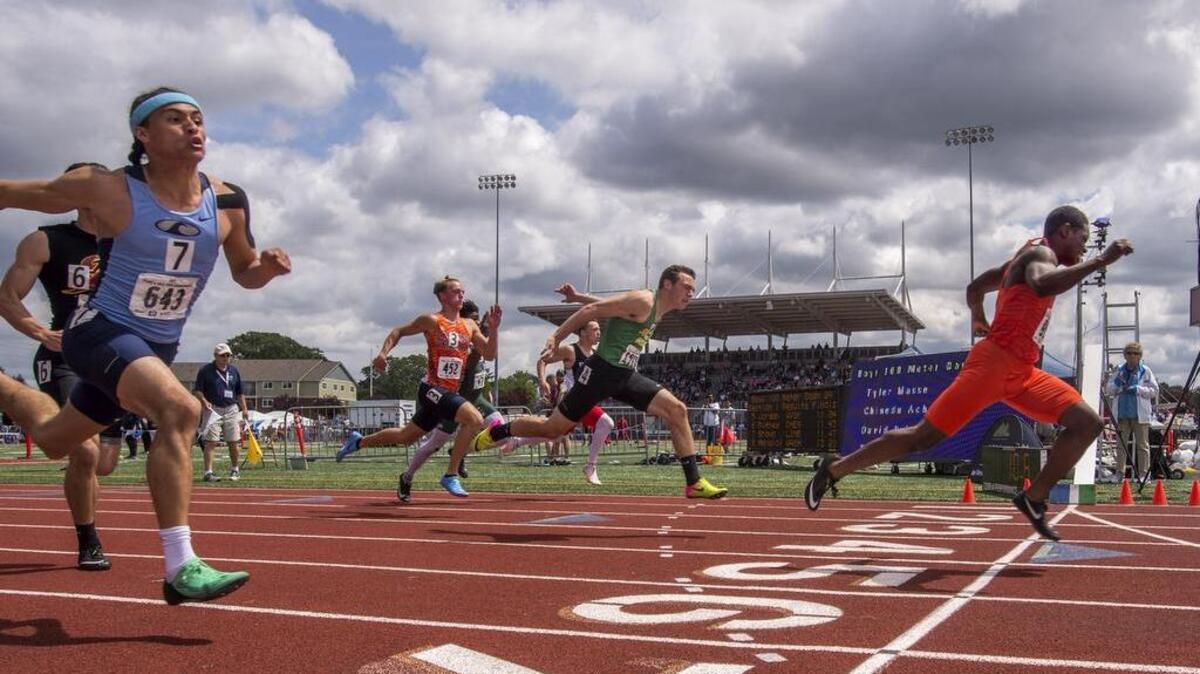 Dorien Simon of Lakes cleans up in the boys 3A 100 meter dash at the state 2A, 3A, 4A Track & Field Championships held at Mt. Tahoma High School, May 26, 2018.