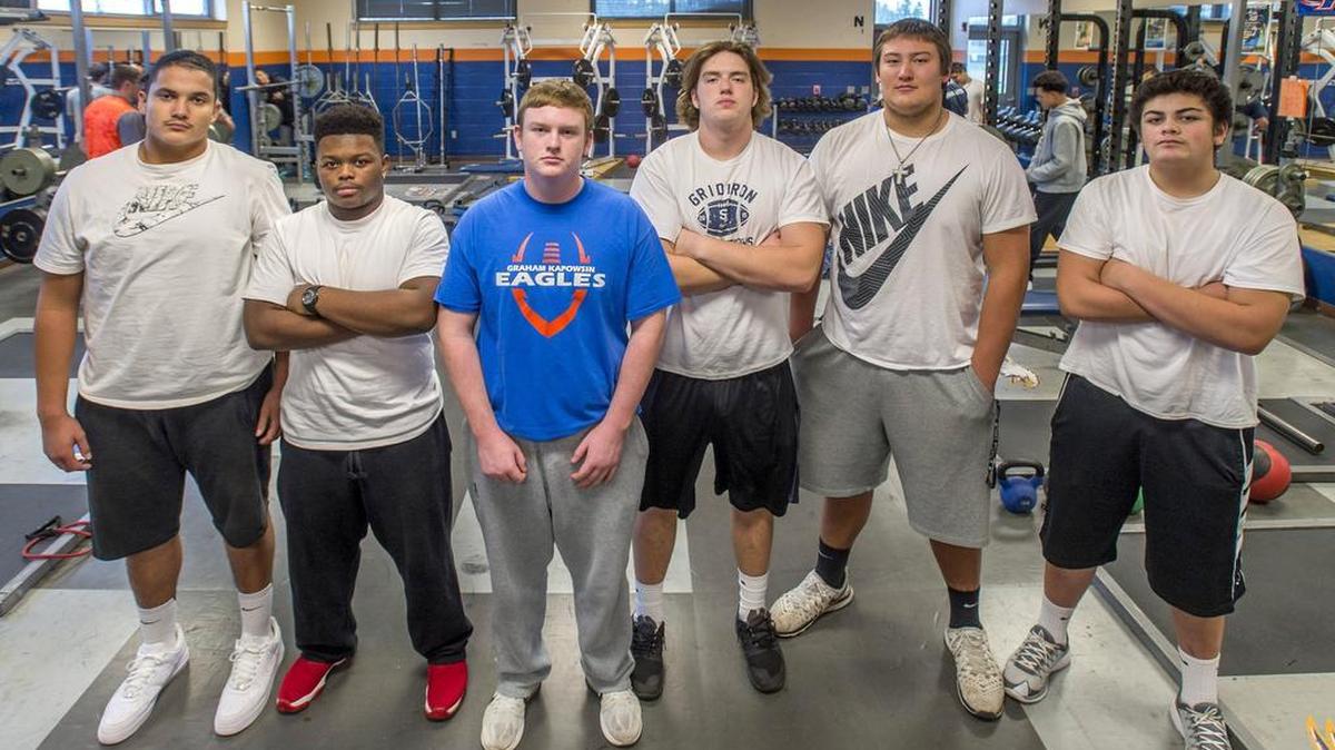 The “Trench Crew” includes, from left, Elijah Lugo, De’Andrae Houston, Ian Kurle, Matt Shook, Foster Sarell and Ethan Tela-Porter, who filled in when Sarell was out with an injury for much of the regular season. “Everything they do, they do a lot of it together,” coach Eric Kurle says.