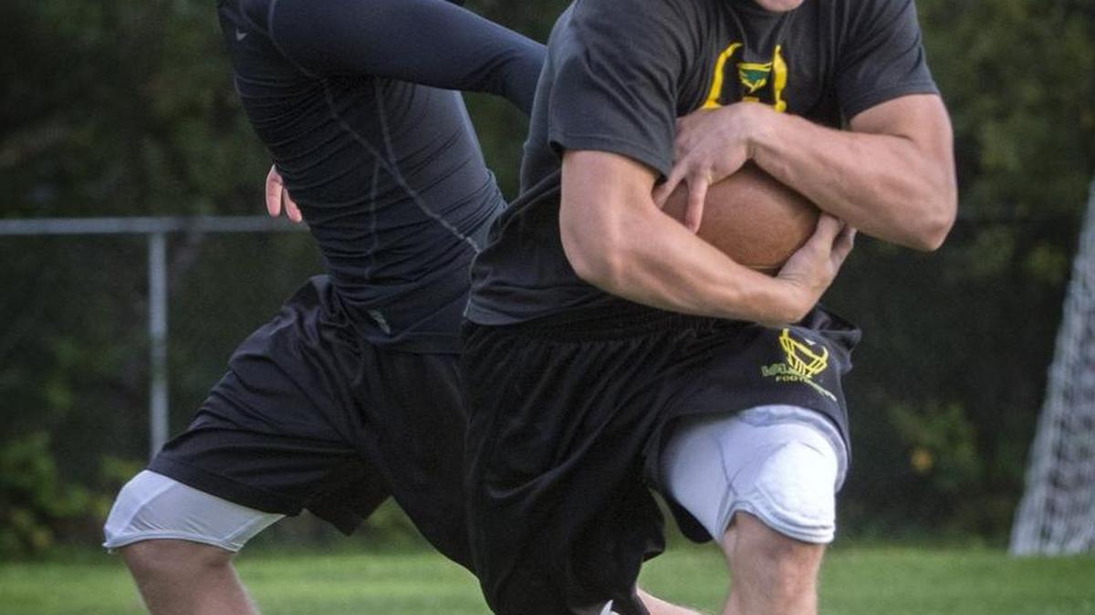 Vashon Island running back Bryce Hoisington, right, taking a handoff from his brother and Pirates quarterback Connor Hoisington, set the state 11-man record Friday for rushing yards in a season with 2,929 after taking 51 carries for 573 yards and nine touchdowns in a 70-31 victory against Coupeville.