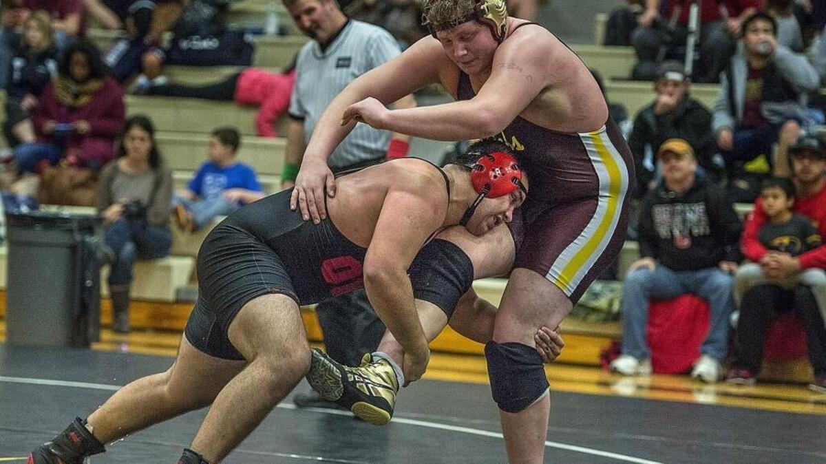 Orting’s Hunter Mullins took the offensive in a 3-1 overtime victory over Chandler Fluaitt of Moses Lake, winning the 285-pound title Saturday at the 39th annual Matman Classic at Central Kitsap High School in Silverdale.