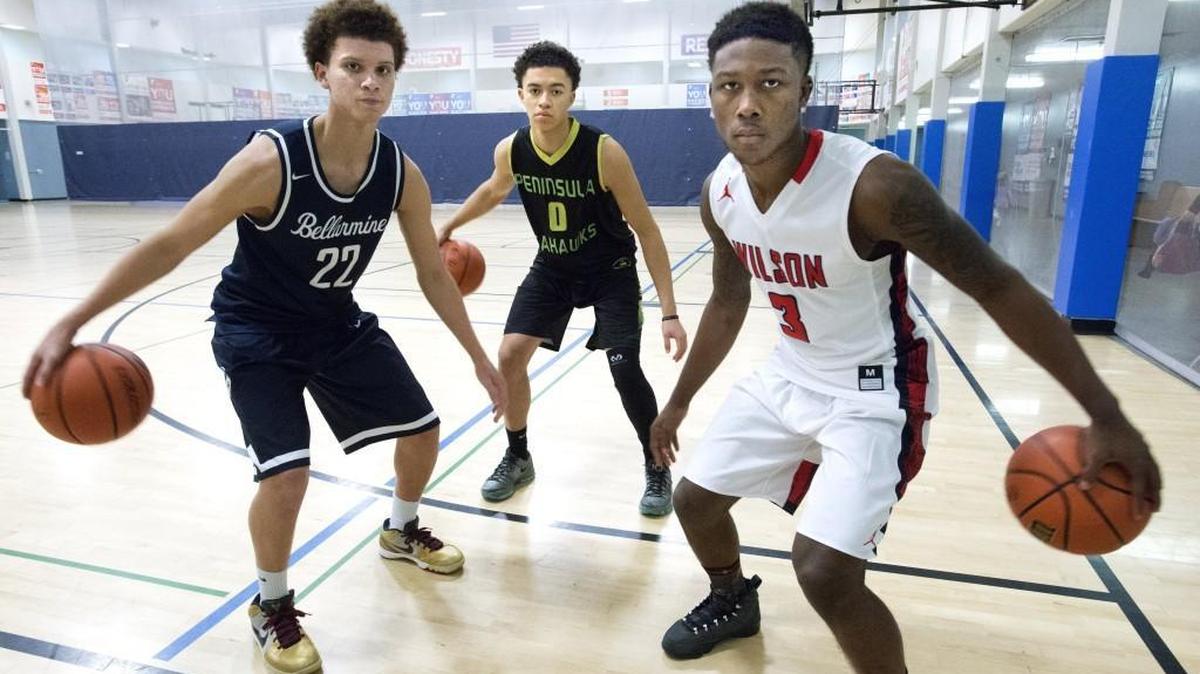 Bellarmine Prep guard Malachi Flynn, left, Peninsula guard JaQuori McLaughlin, center, and Wilson guard David Jenkins Jr., right, are three players to watch this season.