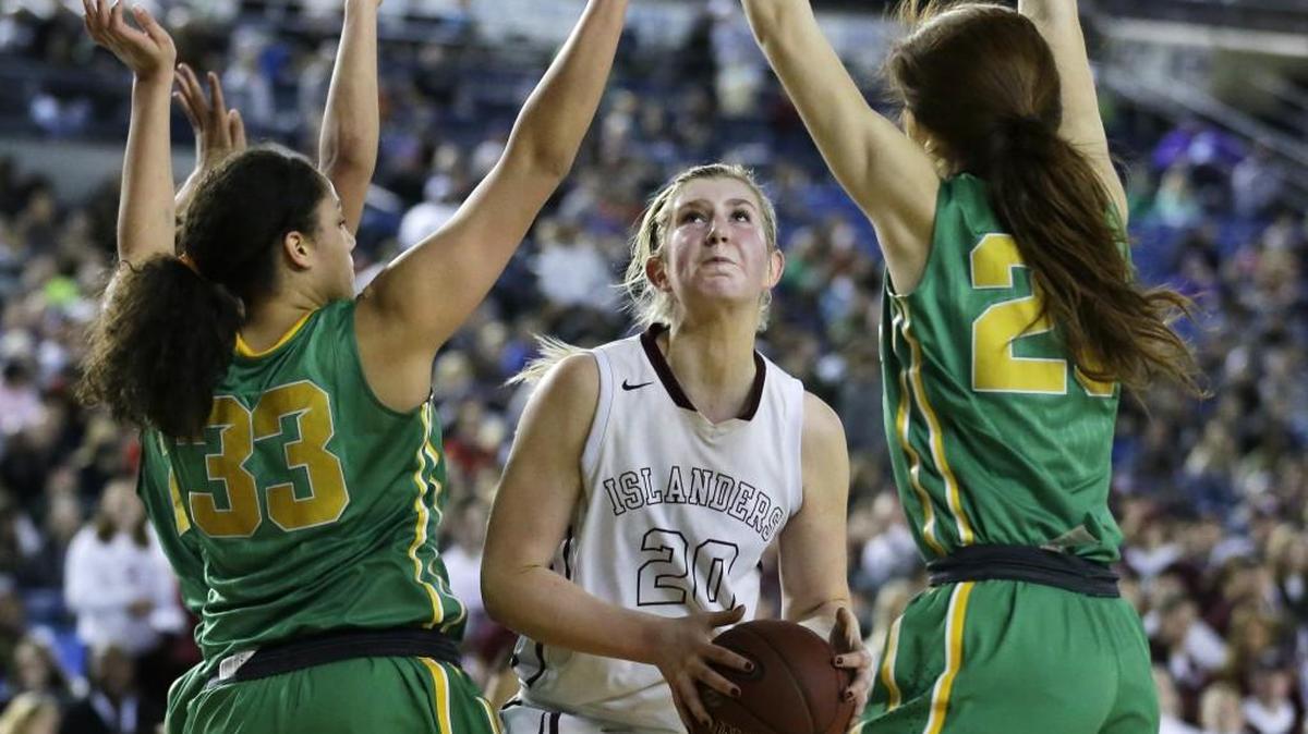Mercer Island center Anna Luce, center, averaged 25.7 points and 10.4 rebounds for the season and is The News Tribune’s 2016-17 all-state girls basketball player of the year.