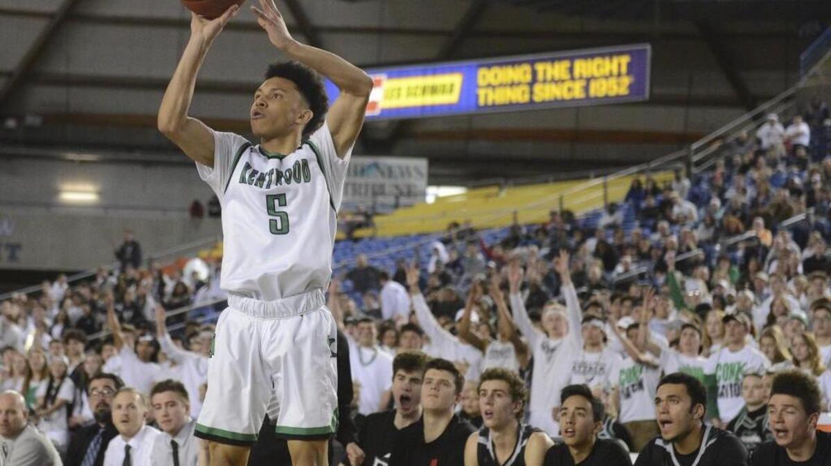 Kentwood's D'Angelo Minnis (5) hits a three-point-shot to tie the game at 35-35 in the second quarter. Kentwood played Union in the 4A boys state championship basketball game at the Tacoma Dome in Tacoma, Wash., on Saturday, March 4, 2017.