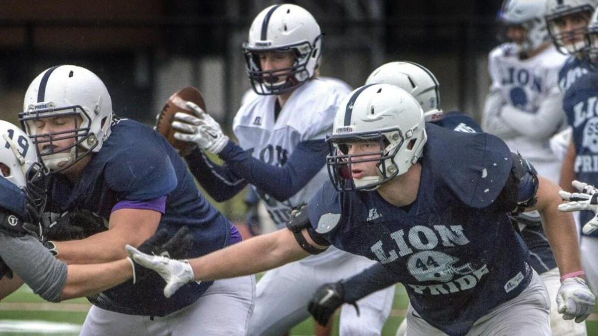 Bellarmine’s Erik Glueck, right, practices Thursday. “You’ve got to hit them before they hit you because being on the receiving end of that is not fun.”