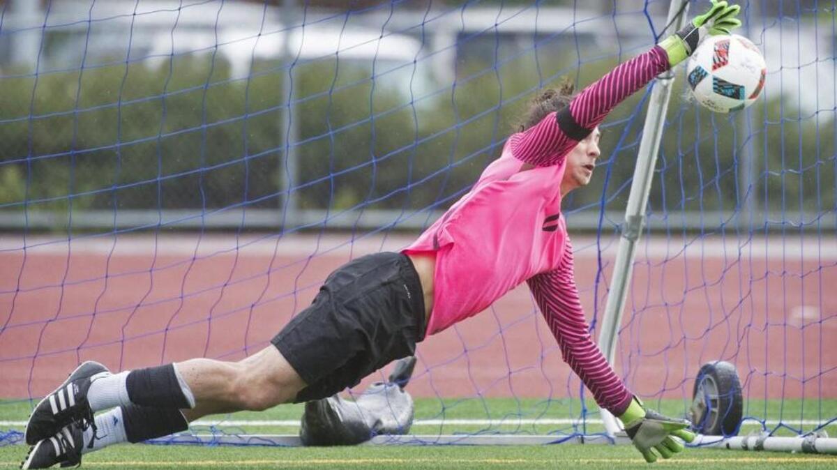 Olympia goalkeeper Matteo Delguidice blocks a penalty kick during Saturday's boys soccer playoff match against Camas at Ingersoll Stadium in Olympia on Saturday, May 12, 2017. With the match tied 1-1 after regulation and two overtimes, the Bears won on penalty kicks, 4-3 after six kicks.