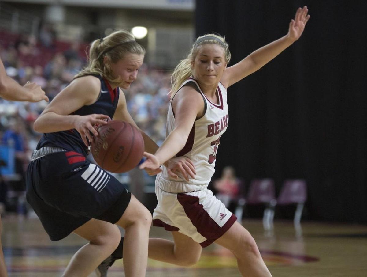 W.F. West's Kiara Steen, in white, steals the ball from Black Hills' Megan River during the Class 2A state tournament.