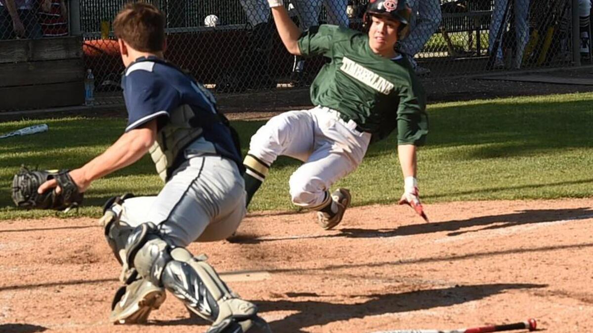 Bears' catcher Brenden Nee waits for the tag at home of the Blazers' No. 64 as Timberline hosted Olympia in a Narrows 4A league game Monday. The out call brought Timberline head coach Mark Rubadue down from third base to challenge it.