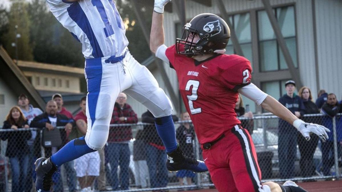 
Eatonville's Brooks Moeller catches a touchdown pass from quarterback Jacob McCormick for the game's first score against Orting's Jon Wilkinson on Friday, Sept. 4, 2015.
