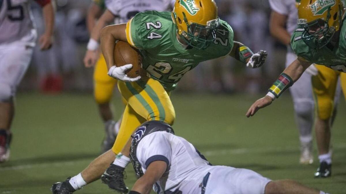 Tumwater running back Dominic Jones breaks loose for 10-yard touchdown run during Friday night's battle of undefeated crosstown rivals in the Pioneer Bowl football game at Tumwater District Stadium on Oct. 23, 2015.